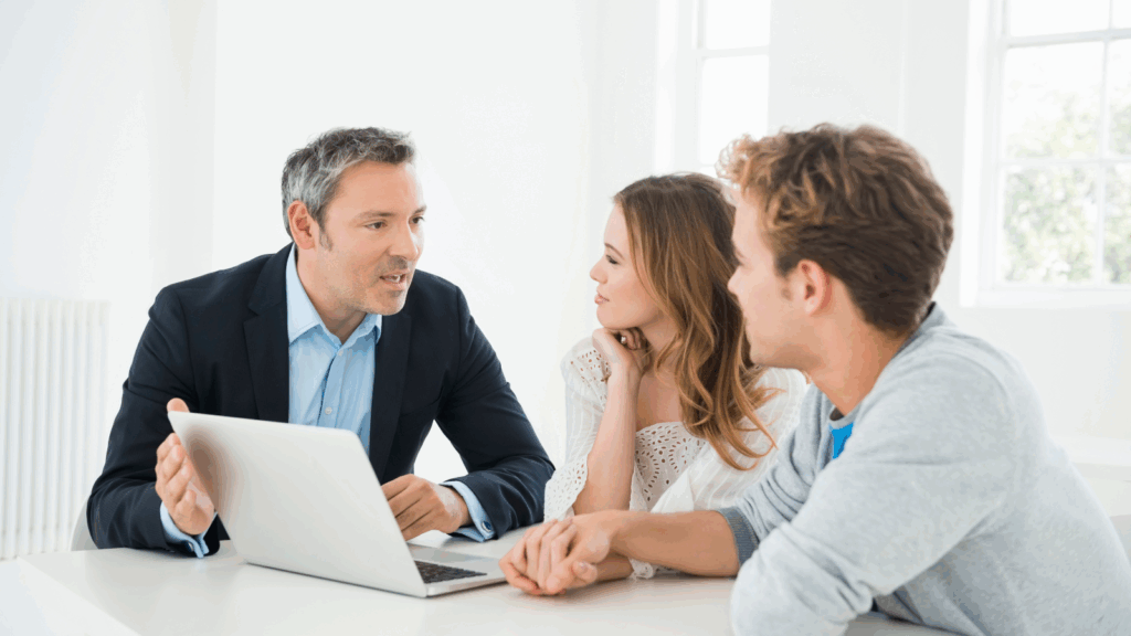 Professional tax advisor discussing S-Corp election option with young couple - small business owners to help them save on taxes legally